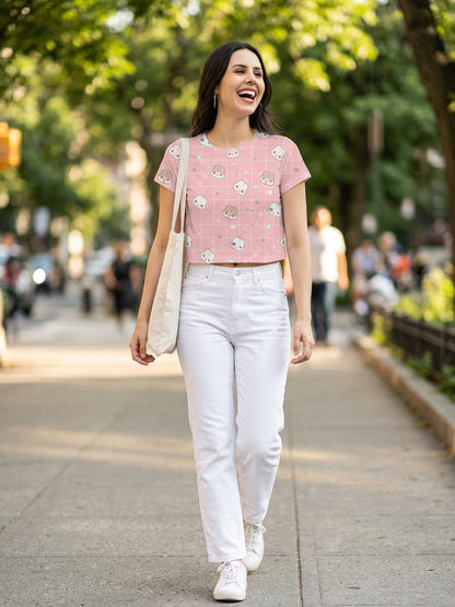 Women's pink toast graphic crop tee worn with white jeans and tote bag, street style